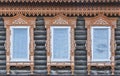 Traditional windows with carved wood platbands. Historic house, Yelabuga, Russia Royalty Free Stock Photo