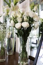 Three transparence vases of three white flowers