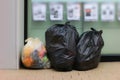 Three Trash Bags, Garbage bag black placed front convenience store, Bin, Trash, trash bag, trash on sidewalk, Three bags bin of ga Royalty Free Stock Photo