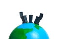 Three trash bin above earth globe. Global waste concept. Miniature people figure photography