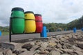 Three Trash Cans, colored Red Yellow and Green