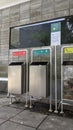 three trash cans. with their respective uses