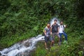 Three trekker in the jungle are roaming around in yuksom in sikkim in monsoom season