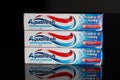 Three tubes of toothpaste