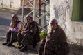 Three Turkish women on the sidewalk in a village