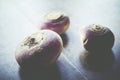 three turnip on a wood background