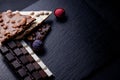 Three types of chocolate - black  milk and white with luxury handmade chocolates on a black background with copy space Royalty Free Stock Photo