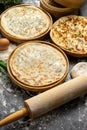 Three types of classic unleavened wheat flatbread with herbs and cheese made from flour, eggs, onions and water.