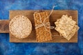 Three types of diet bread. Round buckwheat crispbread, wheat crispbread and crispbread with sunflowe on wooden vintage cutting Royalty Free Stock Photo