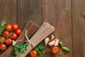 Three types of spaghetti, tomatoes and herbs