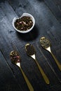 Three types of tea in spoons - green, black and Rooibos Royalty Free Stock Photo