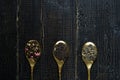 Three types of tea in spoons - green, black and Rooibos Royalty Free Stock Photo