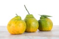 Three ugly tangerines still life