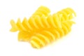 Three uncooked fusilli on white background