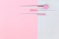 Three unicorn makeup brushes on silver pink