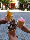 Three unique ice cream in the hands of 3 friends in Przemysl, Poland.