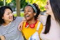 Three united multi-ethnic female friends having fun laughing together outdoor Royalty Free Stock Photo