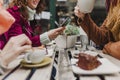 Three unrecognizable women friends having coffee in a terrace in Oporto, Portugal. Having a fun conversation. Lifestyle, tourism Royalty Free Stock Photo