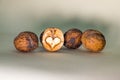 Three unshelled walnuts