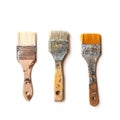 Three used flat brushes in a row for paint, lacquer, varnish or stain isolated with shadows on a white background, copy space, top Royalty Free Stock Photo