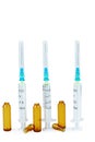 Three used syringes and ampules isolated on white Royalty Free Stock Photo