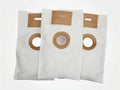 Three Vacuum Cleaner Bags Laying on White Background Royalty Free Stock Photo