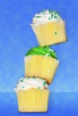 Three vanilla cupcakes tacked on top of each other