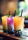 Three Varieties of Bubble Tea With Tapioca Pearls Served on a Wooden Table Royalty Free Stock Photo