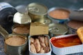 Three varieties of sardine cans, with tomato and with olive and sunflower oil Royalty Free Stock Photo