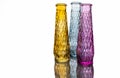 Three vases of colored glass with a pattern Royalty Free Stock Photo