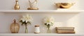 Three vases on a shelf with flowers and books Royalty Free Stock Photo