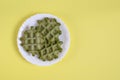 Three vegan green waffles on a plate