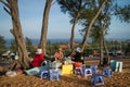 Three Vendors Sitting On A Sand Dune Royalty Free Stock Photo