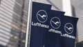 Three vertical banners with the Lufthansa logo fluttering in the wind