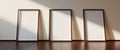three vertical blank frames with spotlights on a wooden floor mockup Royalty Free Stock Photo