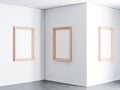 Three Vertical Posters with Wooden Frame Mockup in empty gallery room