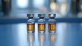 Three vials of amber liquid on a table Royalty Free Stock Photo