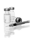 Three vials with hypodermic needle Royalty Free Stock Photo