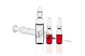 Three vials for injection and a syringe Royalty Free Stock Photo
