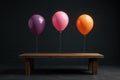 Three vibrant balloons float above a simple wooden table against a dark background, a scene of understated celebration. Generative Royalty Free Stock Photo
