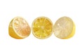 Three vibrant lemon halves arranged in a row showcasing their juicy texture and bright yellow color on a clean white background Royalty Free Stock Photo