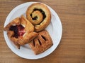 Three Viennoiserie Pastries on a White Plate Royalty Free Stock Photo