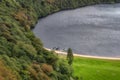 Three Viking longships moored on a dock at Lough Tay in Wicklow Mountains