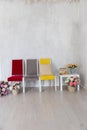 Three old vintage chairs in the interior of an empty white room Royalty Free Stock Photo