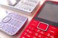 Three vintage colorful cell phone display on white table Royalty Free Stock Photo