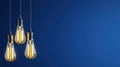 Three Vintage Light Bulbs Hanging Against a Deep Blue Background with Soft Lighting Effects Royalty Free Stock Photo
