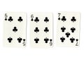 Three vintage playing cards showing a run of clubs.