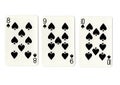 Three vintage playing cards showing a run of spades.