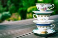 Three vintage porcelain tea cups on the floor with copy space Royalty Free Stock Photo