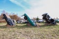 Three vintage retro cars dug vertically in the soil